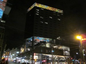 Outside of the hotel at night.